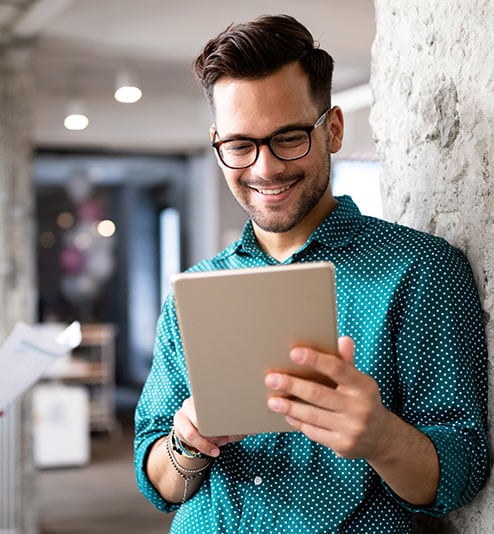 Person using a tablet to control business automation systems