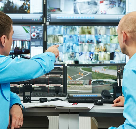 Security guards reviewing video feed