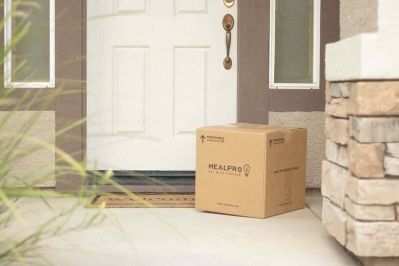 an image of a package by the front door to highlight protecting packages during the holidays