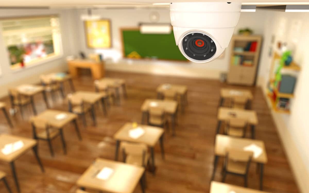 a camera monitors an empty classroom to demonstrate the topic of school security